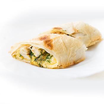 Baked roll made of pita with chicken and mushrooms