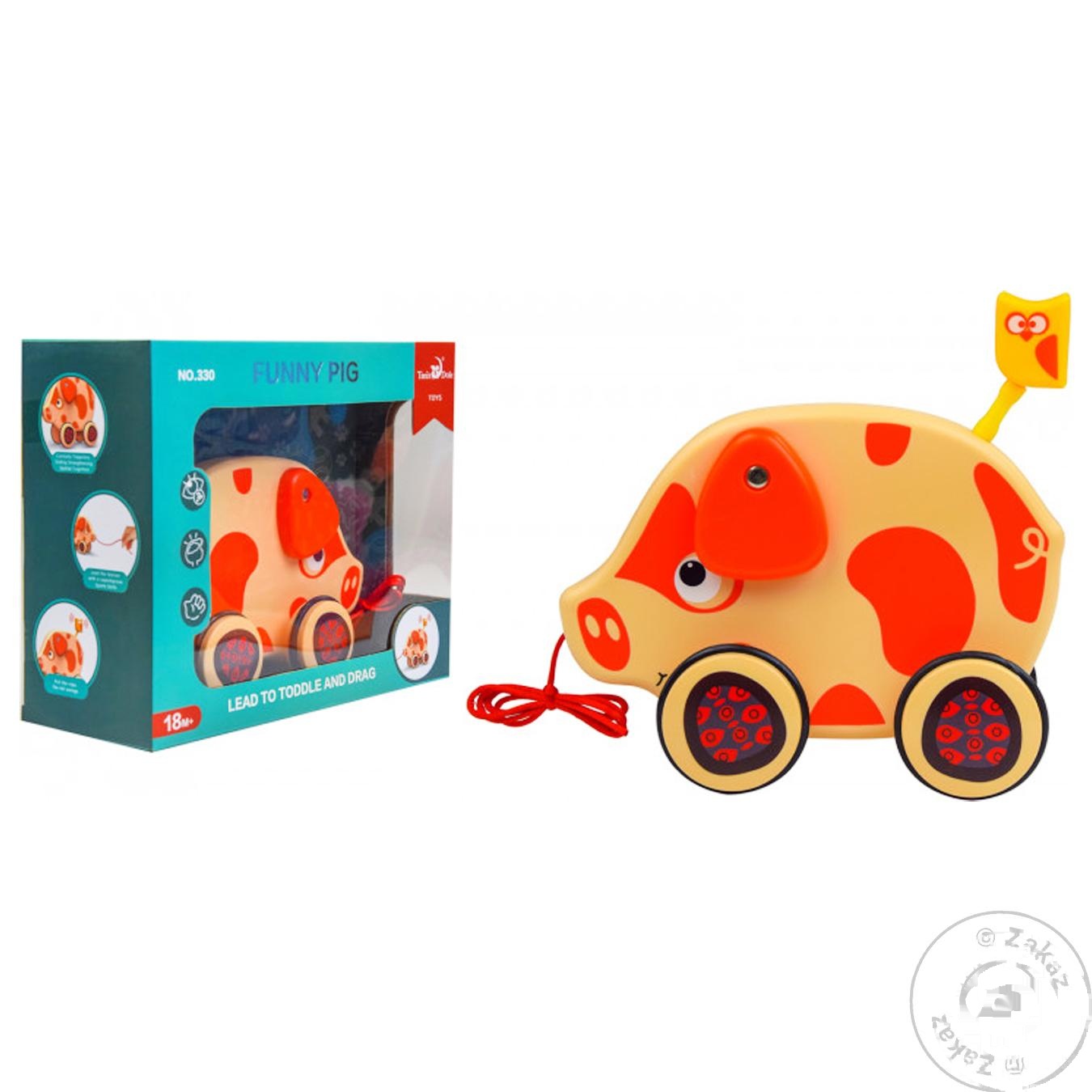 

Игрушка каталка свинка